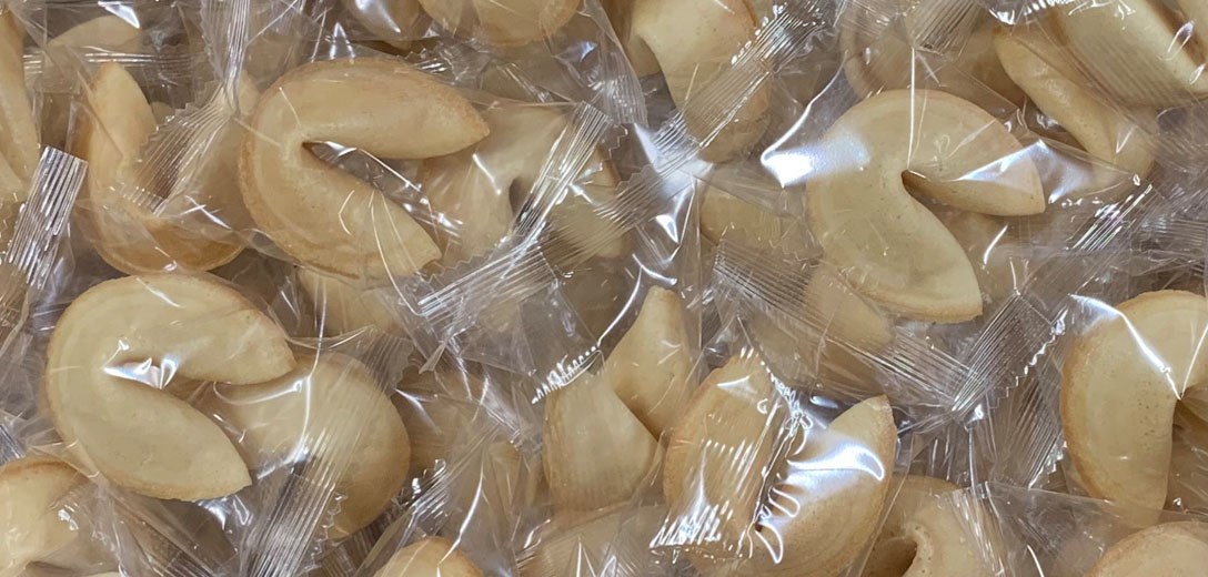 Lots of wrapped fortune cookies.